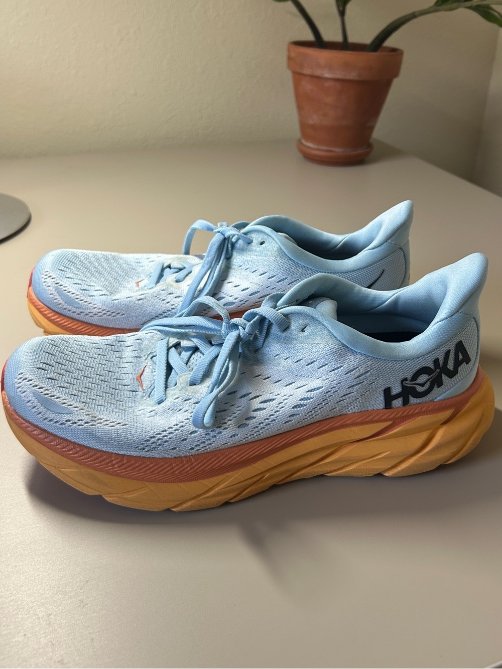 HOKA Blue Running Shoes with Orange Sole